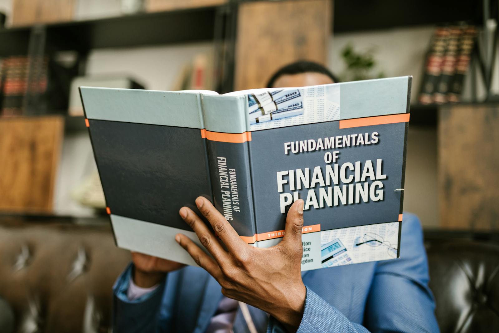 An estate planner reviewing trust and partnership documents at a desk