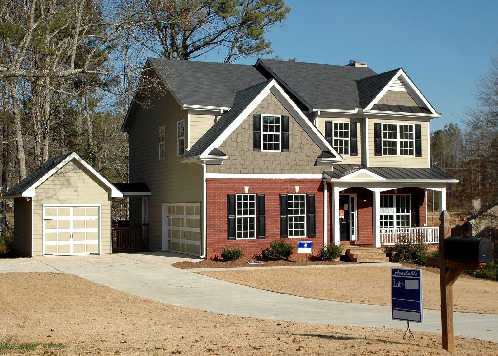 A modern suburban single-family home with attached garage — the low-down-payment 2020–2023 Wasatch Front buyer whose appreciation now qualifies for early PMI cancellation
