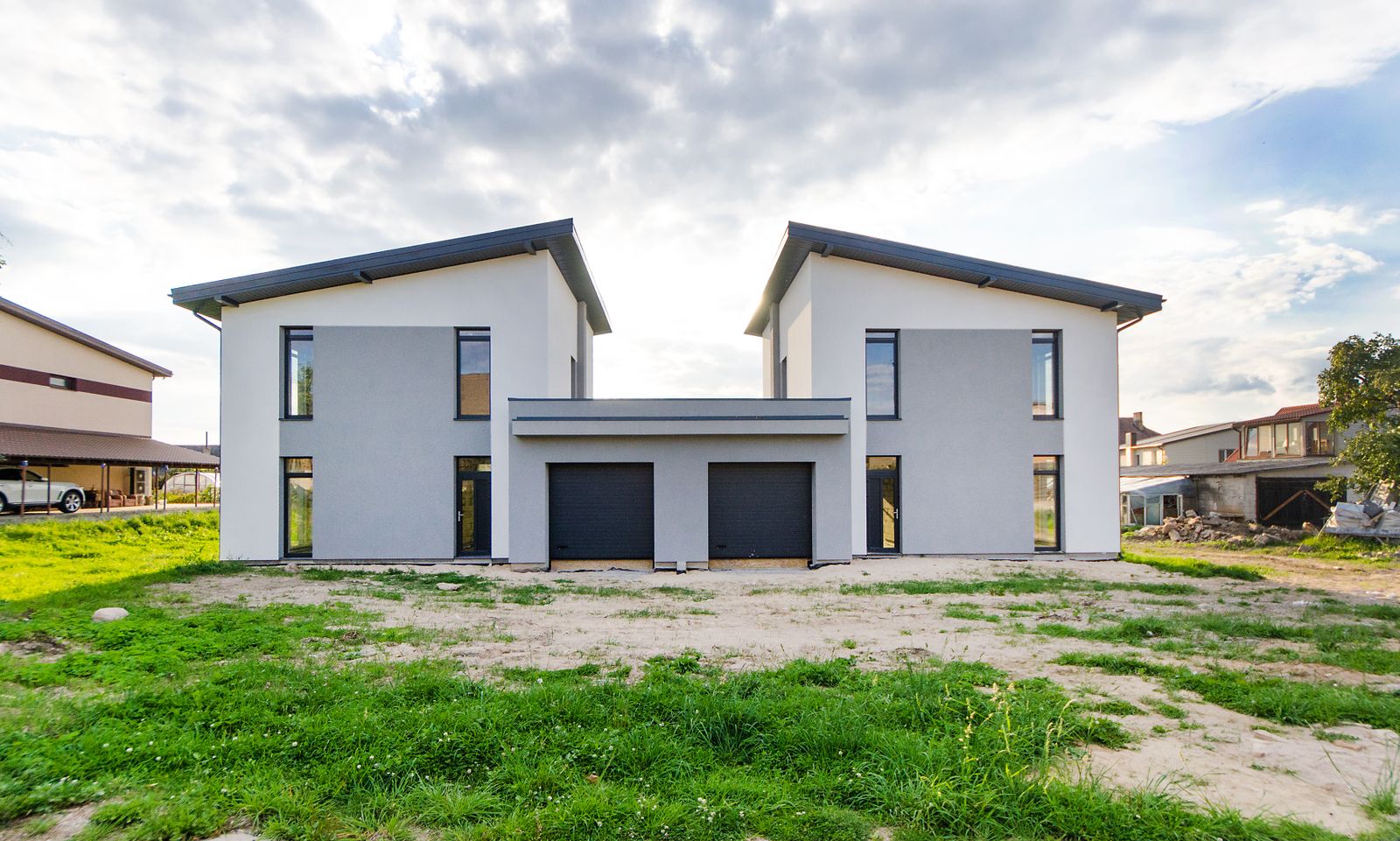 A symmetrical duplex with two front doors — the visual question every divorce appraisal answers